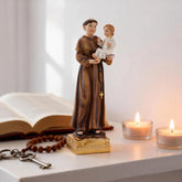 1-saint anthony statue with child jesus on table with rosary and candels