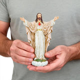 4-handmade sacred heart of jesus statue on model's hands
